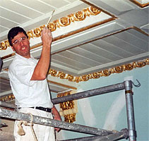 Gold guilding on ceiling cornice.